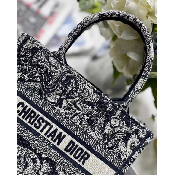 D*or small book tote bag in blue toile de jouy reverse embroidery